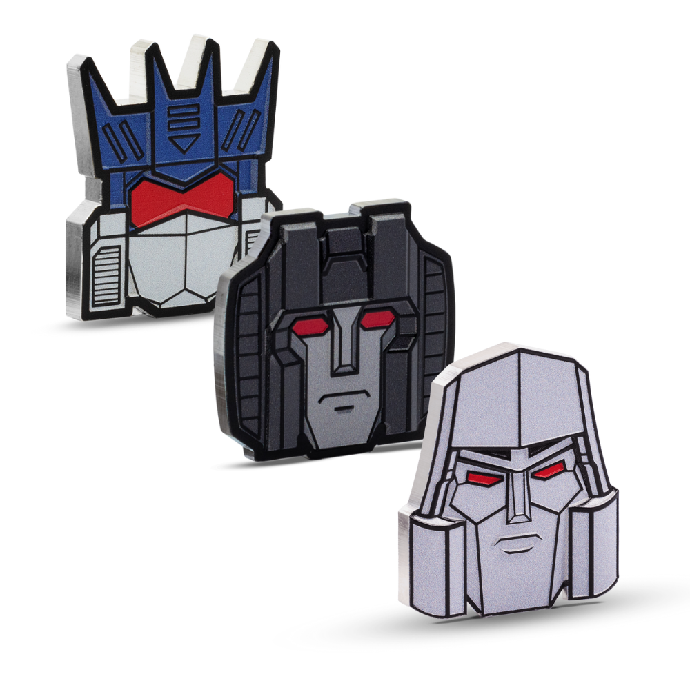 Three robot head-shaped pins with different color schemes on a white background